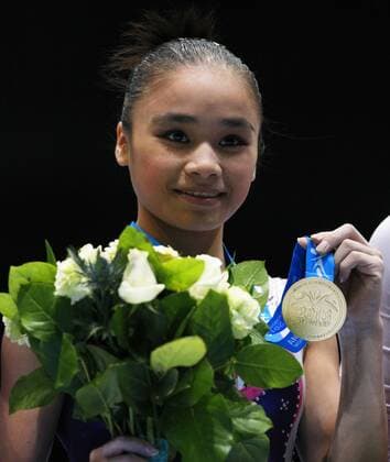 ANTWERP, Oct. 5, 2013 -- Gold medalist Huang Huideng reacts during the awarding ceremony for the woman s uneven bar final of the world gymnastics championships in Antwerp, Belgium, Oct. 5, 2013. 
