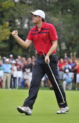 United States Team member Keegan Bradley pumps his fist as he sinks a birdie putt to halve the sixth hole during the third round four-ball competition against the International Team at the 2013 Presidents Cup at Muirfield Village Golf Club in Dublin, Ohio on October 5, 2013.  BKX2013100518