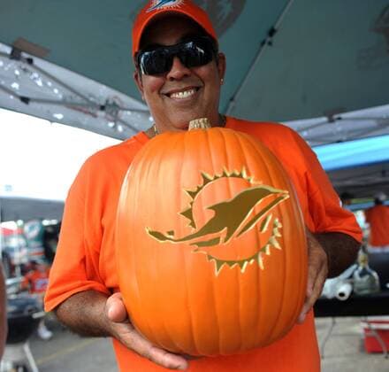 Oct. 6, 2013 - Miami Gardens, FL, USA - Tommy Gonzalez shows off his Dolphins pumpkin on Sunday, October 6, 2013, as Miami faced the Baltimore Ravens at Sun Life Stadium in Miami Gardens, Florida. Dolphines vs. Ravens - ZUMAm67