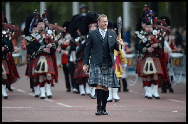 Queen s Baton Relay Launch at Buckingham Palace. Pipes and drums fronted by Sir Chris Hoy set off from Friary Court towards BP Forecourt during the Baton Relay Launch. The QBR Launch is an exceptionally high-profile Games event, an important milestone that begins the QBR that will unite the Commonwealth, at Buckingham Palace, London, United Kingdom. Wednesday, 9th October 2013. Picture by Andrew Parsons i-Images AndrewxParsonsx xi-Images  IIM-0604-0070