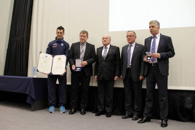Safet Susic (2nd L), coach of the national soccer team of Bosnia and Herzegovina, Emir Spahic (1st L), captain of the team, and FIFA President Joseph Sepp Blatter (C), attend an awarding ceremony in Sarajevo, Bosnia and Herzegovina (BiH), on Oct. 10, 2013. Blatter, as Honorary Ambassador of Sports and Culture of Peace International League of Humanists, awarded BiH national soccer team and Susic the Golden Charter Sports and Culture of Peace Juan Antonio Samaranch . (Xinhua Haris Memija) (SP)BOSNIA AND HERZEGOVINA-SOCCER-BLATTER-AWARD