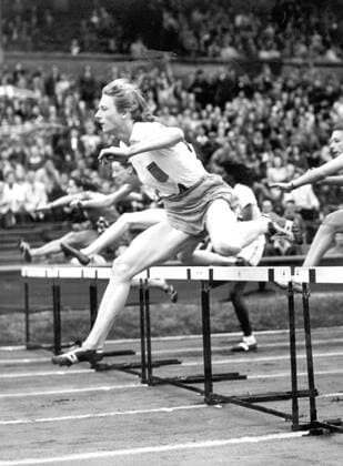 Fanny Blankers-Koen beat the Olympic and World records when she won heat 1 of the 80 metres Hurdles, at the Empire Stadium, Wembley, London, in a time of 11.3 seconds. She is pictured taking the second hurdle in the event. kbdig 1948 hoch Athelete jump 