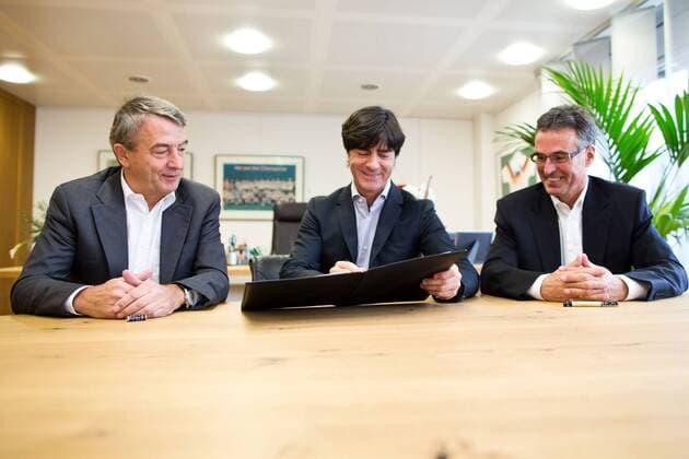 FRANKFURT AM MAIN, GERMANY - OCTOBER 18: DFB President Wolfgang Niersbach, head coach Joachim Löw and DFB General Secretary Helmut Sandrock (L-R) sign the new contract of Joachim Löw during the announcement of the renewal of Joachim Loews contract at DFB headquarters on October 18, 2013 in Frankfurt am Main, Germany. Wolfgang Niersbach; Joachim Löw; Helmut Sandrock