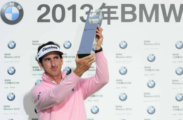 Oct. 27, 2013 - Oct 27, 2013; Shanghai, CHINA; Gonzalo Fernandez-Castano of Spain poses with the trophy after wining the BMW Masters at Lake Malaren Golf Club. BMW Masters Golf Tournament  - ZUMAs11