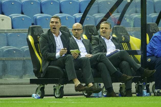 (L-R) assistant trainer Henri Kruzen of Vitesse, coach Peter Bosz of Vitesse, assistant trainer Albert Capellas of Vitesse during the Dutch Eredivisie match between Vitesse Arnhem and FC Groningen on October 27, 2013 at the Gelredome stadium in Arnhem, The Netherlands. Vitesse v FC Groningen Dutch Eredivisie 2013 2014 xVIxxIVx 1872824