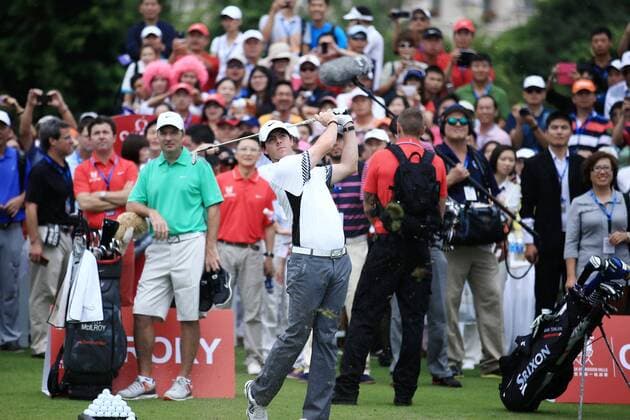 Rory McIlroy of Northern Ireland, center, plays a shot during The Match at Mission Hills in Haikou city, south Chinas Hainan province, 28 October 2013.  pau902455_13