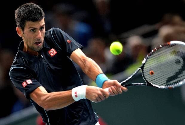 Serbia s Novak Djokovic returns the ball during the quarterfinal match of the BNP Paribas 2013 Masters Tennis tournament in Paris, France, on Nov. 1, 2013.. (Xinhua Chen Xiaowei) (SP)FRANCE-PARIS-ATP-BNP MASTERS TENNIS 
