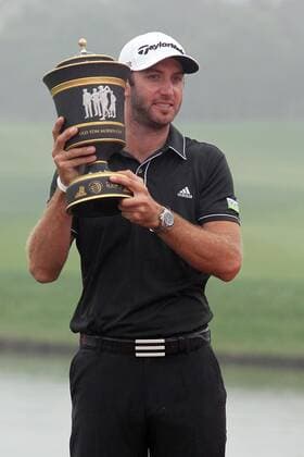Golfer Dustin Johnson of the United States poses with his champion trophy during the award ceremony of the HSBC Champions golf tournament in Shanghai, China, 3 November 2013. American golfer Dustin Johnson won the champion of the HSBC Champions golf tournament at the Sheshan International Golf Club in Shanghai, China, 3 Nov 2013. Against all the other contenders, Johnson pulled away with power and a clutch putt to win his first World Golf Championship in Shanghai. Dustin Johnson wins championship of HSBC Champions golf tournament in Shanghai  pau905496_06