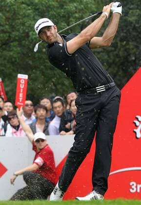 Golfer Dustin Johnson of the United States plays a shot during the final of the HSBC Champions golf tournament in Shanghai, China, 3 November 2013. American golfer Dustin Johnson won the champion of the HSBC Champions golf tournament at the Sheshan International Golf Club in Shanghai, China, 3 Nov 2013. Against all the other contenders, Johnson pulled away with power and a clutch putt to win his first World Golf Championship in Shanghai. Dustin Johnson wins championship of HSBC Champions golf tournament in Shanghai  pau905494_02