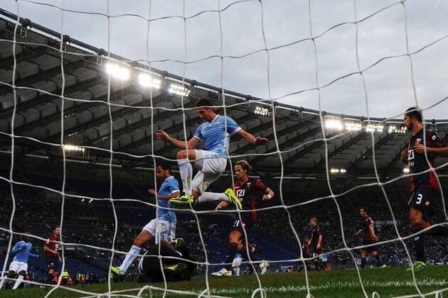 Genoa goalkeeper Mattia Perin saves on Miroslav Klose of Lazio Parata Mattia Perin Miroslav Klose - Lazio Rom vs Genoa CFC 1893 FC - andreaxstaccioli