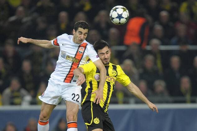 Dienstag 05.03.2013, UEFA Champions League, Saison 12 13 - in Dortmund, Achtelfinale, Rueckspiel, BV Borussia Dortmund - Schachtar Donezk, Genrik Mkhitaryan (Schachtar Donezk) gegen Ilkay Guendogan (BVB) DeFodi018