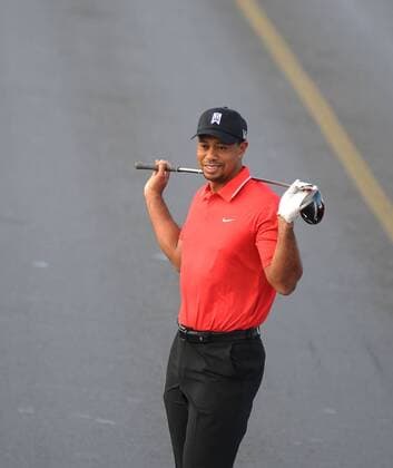 U.S. golfer Tiger Woods hits a ball as he poses during an event to promote the upcoming Turkish Airlines Open golf tournament, on the Bosphorus Bridge that links the city s European and Asian sides, in Istanbul, on November 5, 2013. Woods is in Turkey to attend the tournament, which will take place in Antalya, southern Turkey, between November 7 to 10, 2013. 