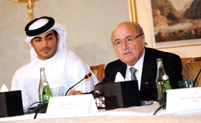(131109) -- DOHA, Nov. 9, 2013 (Xinhua) -- FIFA President Sepp Blatter (R) answers questions during a Media Briefing in Doha, Qatar on Nov. 9, 2013. (Xinhua Chen Shaojin) (SP)QATAR-DOHA-SOCCER 