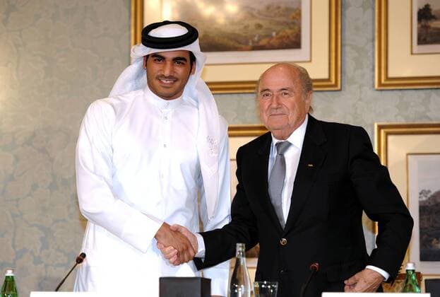 (131109) -- DOHA, Nov. 9, 2013 (Xinhua) -- FIFA President Sepp Blatter (R) shakes hands with Sheikh Mohammed Bin Hamad Al Thani, Managing Director Qatar 2022 Supreme Committee during a Media Briefing in Doha, Qatar on Nov. 9, 2013. (Xinhua Chen Shaojin) (SP)QATAR-DOHA-SOCCER 