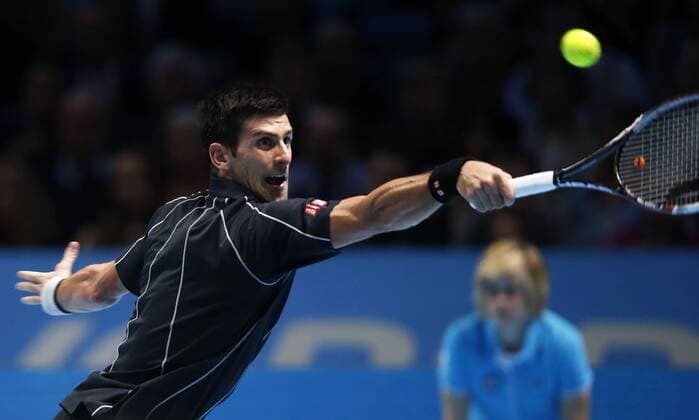 LONDON, Nov. 11, - Novak Djokovic of Serbia returns the ball during the Singles Final on day 8 of the Barclays ATP Tennis Herren World Tour Finals at the O2 Arena in London, Britain, Nov. 11, 2013. (Xinhua Wang Lili) (SP)BRITAIN-LONDON-TENNIS-ATP FINALS-DAY 8-SINGLES-FINALS 