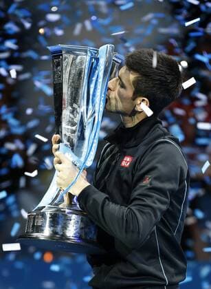 LONDON, Nov. 11, - Novak Djokovic of Serbia kisses the champion trophy during the awarding ceremony for the Singles Final on day 8 of the Barclays ATP Tennis Herren World Tour Finals at the O2 Arena in London, Britain, Nov. 11, 2013. (Xinhua Wang Lili) (SP)BRITAIN-LONDON-TENNIS-ATP FINALS-DAY 8-SINGLES-FINALS 