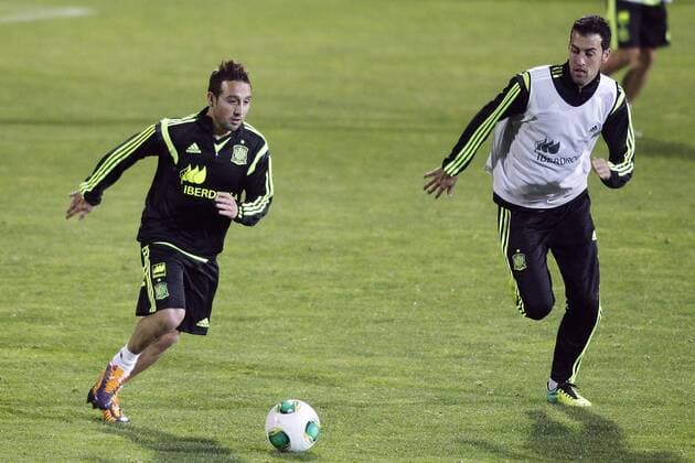 Spanish soccer team trains before they trip to South Africa in Madrid, Spain. In the pic: Santi Cazorla and Sergio Busquets. November 14, 2013.  (20147905)