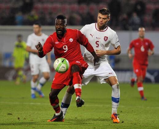 Czech Republic s Ondrej Celustka, right, fight for the ball with Canada s Tosaint Ricketts during their friendly soccer match in Oloumouc, Czech Republic, Friday, November 15, 2013. (CTKxPhoto LudekxPerina) CTKPhotoP201311150725601  LPE 012