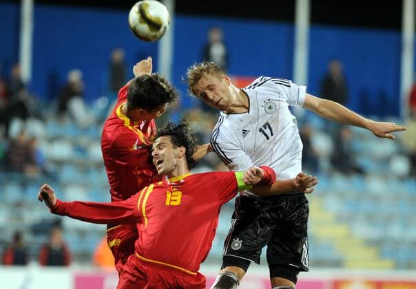 15.11.2013 Podgorica(Montenegro) Montenegro - Germany Uefa U21 Euro qualifiers men s football Philipp Hofmann(r) Germany and Ermin Alic (c) Montenegro :Stringer 