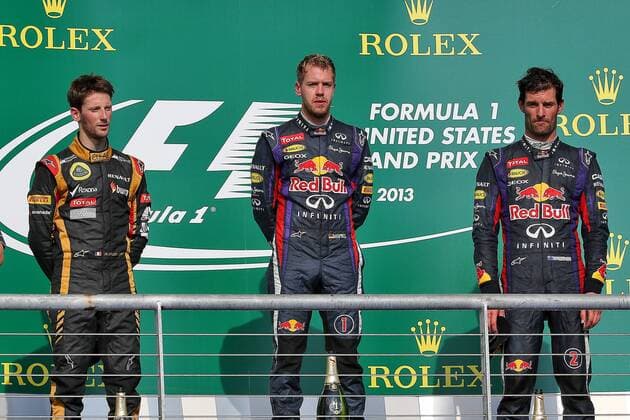 Nov. 17, 2013 - Austin, Texas, U.S - MARK WEBBER (2) driver of the Red Bull Racing Renault, SEBASTIAN VETTEL (1) driver of the Red Bull Racing Renault and ROMAIN GROSJEAN (8) driver of the Lotus F1 Team Renault stand on the winners podium after the Formula 1 United States Grand Prix race at the Circuit of the Americas race track in Austin,Texas. F1 2013 - United States Grand Prix .. - ZUMAw30