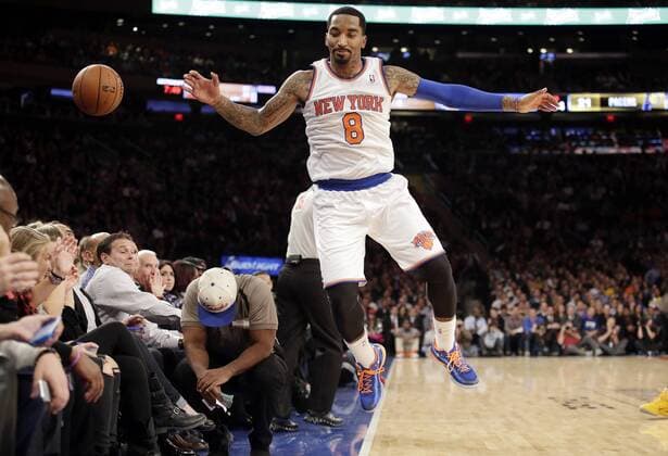 New York Knicks J.R. Smith leaps to save a ball from going out of bounds in the first half against the Indiana Pacers at Madison Square Garden in New York City on November 20, 2013.  NYP20131120153