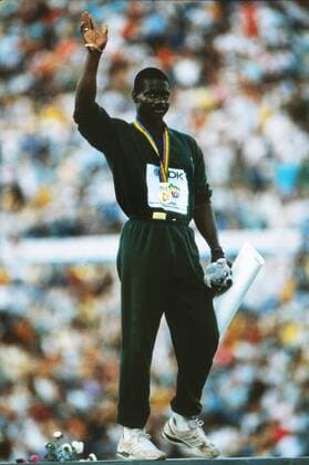Athletics - 1987 IAAF Rome World Championships - Men s 100m Medal Presentation Canada s Ben Johnson receives his gold medal after sensationally setting a new World Record of 9.83s at the Stadio Olimpico. 30 08 1987 