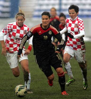 27.11.2013 Osijek(Croatia) Croatia-Germany FIFA World Cup qualify women football Dzsenifer Marozsan(c) Germany between Gabrijela Gaiser(L) and Violeta Baban (r) Croatia : 