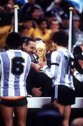 Argentina Captain Daniel Passarella (no.19) is handed the World Cup by leader of the Military Junta General Videla (with moustache) Argentina v Holland, World Cup Final, Buenos Aires, Argentina, 25 06 1978. 