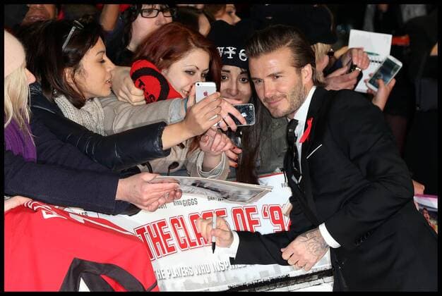 David Beckham signs autographs as he arrives at the The Class of 92 premiere in London, Sunday, 1st December 2013. Picture by Stephen Lock i-Images StephenxLockx xi-Images  IIM-0959-0045