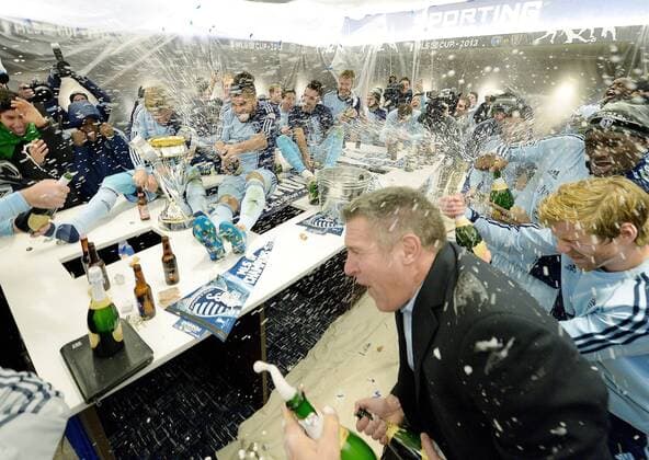 Dec. 7, 2013 - Kansas City, KS, USA - Sporting KC head coach Peter Vermes, right, joins the team in celebrating in the locker room after defeating Real Salt Lake in the MLS Fussball Herren USA Cup Final at Sporting Park in Kansas City, Kan., Saturday, Dec. 7, 2013. Sporting won on penalty kicks. 2013 MLS Fussball Herren USA Cup - ZUMAm67