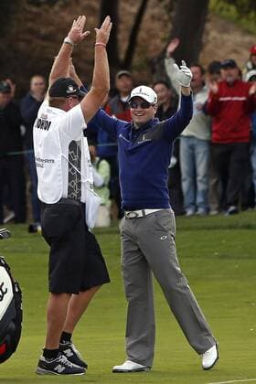 Dec. 8, 2013 - Thousand Oaks, California, U.S. - ZACH JOHNSON, right, reacts to holing out for par from the fairway on the 18th hole during the final round of the Northwestern Mutual World Challenge at Sherwood Country Club. GOLF 2013 - Northwestern Mutual World Challenge - ZUMAcb8