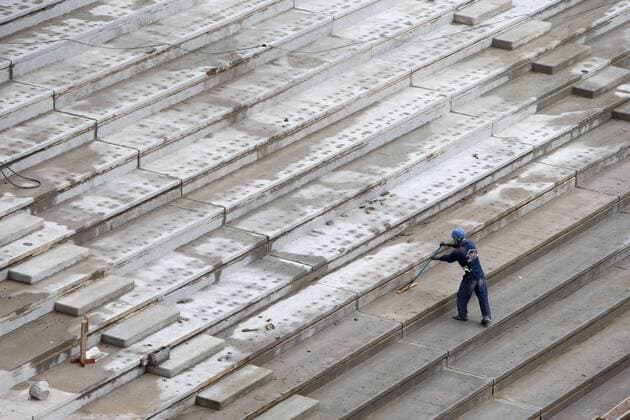 A worker works at the construction site of Arena da Baixada in Curitiba, Brazil, Dec. 14, 2013. Arena da Baixada, which has 43,000 seats, will host 4 group matches during the 2014 FIFA World Cup. (Xinhua Xu Zijian) (SP)BRAZIL-CURITIBA-ARENA DA BAIXADA-VISIT 