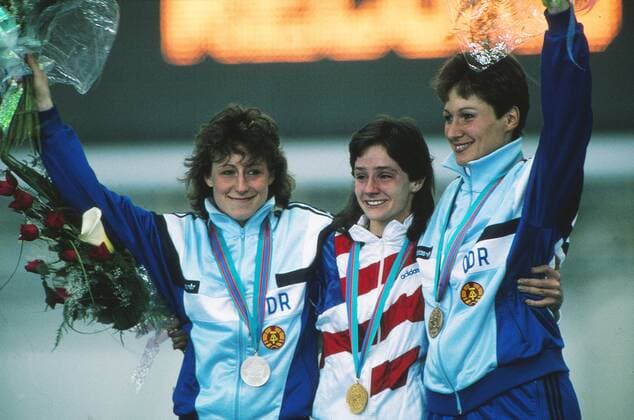 Speed Skating - 1988 Calgary Winter Olympics - Women s 500m Medal Presentation Left to right: East Germany s Christa Rothenburger Luding (silver), USA s Bonnie Blair (gold), and East Germany s Karin Enke-Kania (bronze) at the Olympic Oval, Calgary, Canada. Blair won the gold medal in a new World Record, and it was the first of her three consecutive Olympic titles in the 500m. In all she won five Olympic speed skating gold medals. Later that year Rothenburger won a silver medal in sprint cycling at the Seoul Olympics, becoming the first woman to win medals in both the Winter and Summer Olympics. 22 02 1988 