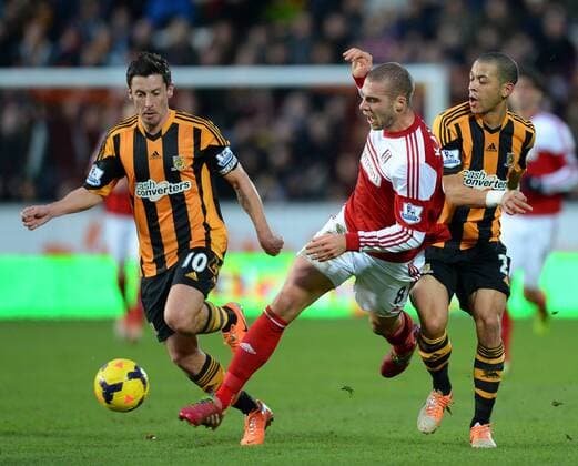 Liam Rosenior (R) and Robert Koren of Hull City tackle Pajtim Kasami of Fulham - Barclays Premier League - Hull City vs Fulham - Kingston Communications Stadium - Hull - England - 28th December 2013 - Picture Simon Bellis Sportimage EDITORIAL USE ONLY. No use with unauthorised audio, video, data, fixture lists, club league logos or live services. Online in-match use limited to 120 images, no video emulation. No use in betting, games or single club league player publications.