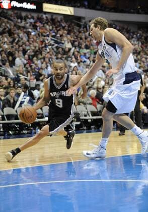 December 26, 2013: San Antonio Spurs point guard Tony Parker 9 drives around Dallas Mavericks power forward Dirk Nowitzki 41 during an NBA Basketball Herren USA game between the San Antonio Spurs and the Dallas Mavericks at the American Airlines Center in Dallas, TX San Antonio defeated Dallas 116-107 NBA Basketball Herren USA DEC 26 Spurs at Mavericks Icon2013122664 EDITORIAL USE ONLY