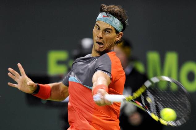 Rafael Nadal of Spain returns the ball during the men s singles final in Qatar Open tennis tournament, Jan. 4, 2014. Nadal won 2-1 to claim the champion. (Xinhua Chen Shaojin) (SP)QATAR-DOHA-TENNIS-MEN 