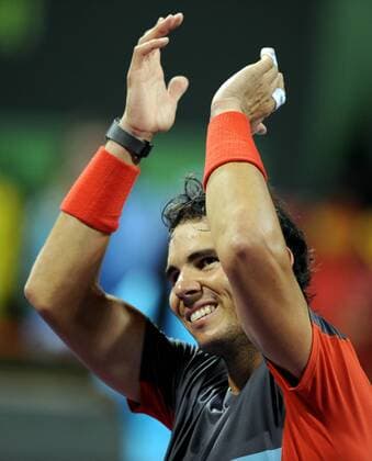 Rafael Nadal of Spain greets the audience after the men s singles final in Qatar Open tennis tournament, Jan. 4, 2014. Nadal won 2-1 to claim the champion. (Xinhua Chen Shaojin) (SP)QATAR-DOHA-TENNIS-MEN 