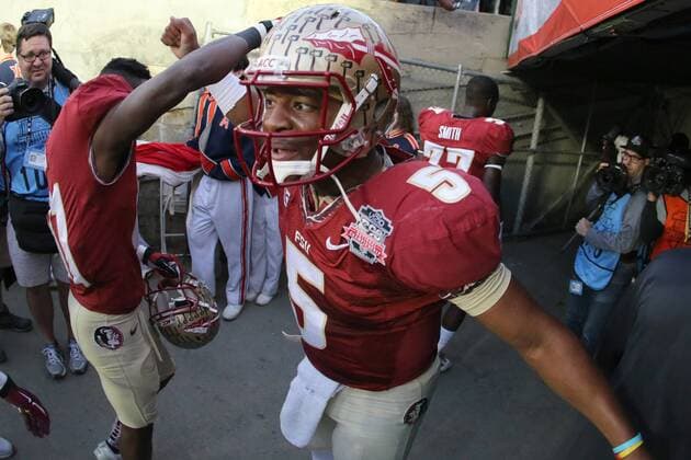Jan. 6, 2014 - Pasadena, California, United States of America - Quarterback Jameis Winston 5 of the Florida State Seminoles pumps players up as they head into the locker room..During the BCS Championship Game in Pasadena, California. Between the 1 ranked Florida State Seminoles and the 2 ranked Auburn Tigers. The final game of the Bowl Championship Series, before moving to a four team playoff system. NCAA College League USA Football 2014 - Jan 6 - BCS Championship Game - Florida St vs Auburn - ZUMAl30