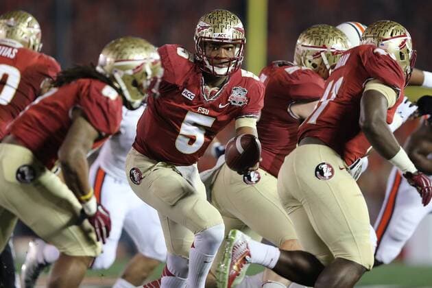 Jan. 6, 2014 - Pasadena, California, United States of America - Quarterback Jameis Winston 5 of the Florida State Seminoles hands off to running back Devonta Freeman 8 of the Florida State Seminoles. During the BCS Championship Game in Pasadena, California. Between the 1 ranked Florida State Seminoles and the 2 ranked Auburn Tigers. The final game of the Bowl Championship Series, before moving to a four team playoff system. NCAA College League USA Football 2014 - Jan 6 - BCS Championship Game - Florida St vs Auburn - ZUMAl30