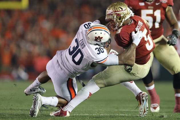 Jan. 6, 2014 - Pasadena, California, United States of America - Defensive end Dee Ford 30 of the Auburn Tigers, drags down and sacks, Quarterback Jameis Winston 5 of the Florida State Seminoles.During the BCS Championship Game in Pasadena, California. Between the 1 ranked Florida State Seminoles and the 2 ranked Auburn Tigers. The final game of the Bowl Championship Series, before moving to a four team playoff system. NCAA College League USA Football 2014 - Jan 6 - BCS Championship Game - Florida St vs Auburn - ZUMAl30
