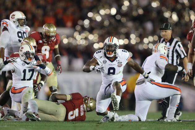 Jan. 6, 2014 - Pasadena, California, United States of America - Linebacker Cassanova McKinzy 8 of the Auburn Tigers celebrates a sack of quarterback Jameis Winston 5 of the Florida State Seminoles.During the BCS Championship Game in Pasadena, California. Between the 1 ranked Florida State Seminoles and the 2 ranked Auburn Tigers. The final game of the Bowl Championship Series, before moving to a four team playoff system. NCAA College League USA Football 2014 - Jan 6 - BCS Championship Game - Florida St vs Auburn - ZUMAl30