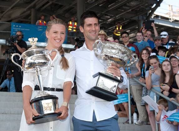 Defending champions Victoria Azarenka (L) of Belarus and Novak Djokovic of Serbia pose with their trophies prior to the official draw of the Australian Open tennis championship in Melbourne, Australia, Jan. 10, 2014. (Xinhua Bai Xue) (SP)AUSTRALIA-MELBOURNE-TENNIS-AUSTRALIA OPEN-DRAW 