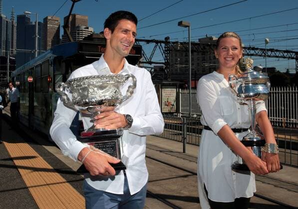 Defending champions Victoria Azarenka (R) of Belarus and Novak Djokovic of Serbia pose with their trophies prior to the official draw of the Australian Open tennis championship in Melbourne, Australia, Jan. 10, 2014. (Xinhua Bai Xue) (SP)AUSTRALIA-MELBOURNE-TENNIS-AUSTRALIA OPEN-DRAW 