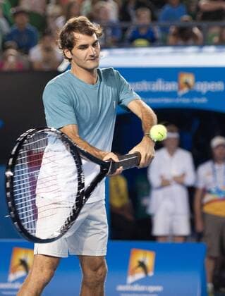 (140111) -- MELBOURNE, Jan. 11, 2014 (Xinhua) -- Roger Federer of Switzerland returns the ball with a giant racquet during the Kids Day exhibition match ahead of the Australian Open tennis tournament in Melbourne, Australia, Jan. 11, 2014. (Xinhua Bai Xue) (SP)AUSTRALIA-MELBOURNE-TENNIS 