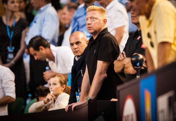 Jan. 13, 2014 - Melbourne, Victoria, Australia - Tennis legend Boris Becker - in black shirt -watches as his student - Novak Djokovic (SRB) in day one play of the 2014 Australian Open In Melbourne. 2014 Tennis - Australian Open - Day 1 - ZUMAkh1