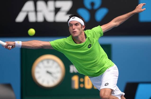 (140115) -- MELBOURNE, Jan. 15, 2014 (Xinhua) -- Leonardo Mayer of Argentina hits a return during his men s singles second round match at the 2014 Australian Open tennis tournament in Melbourne Australia, on Jan. 15, 2014. Mayer lost 0-3. (Xinhua Li Jundong) (SP)AUSTRALIA-MELBOURNE-TENNIS-AUSTRALIAN OPEN 