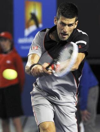 (140117) -- MELBOURNE, Jan. 17, 2014 (Xinhua) -- Novak Djokovic of Serbia hits a return during the men s singles third round match at 2014 Australian Open tennis tournament in Melbourne, Australia, Jan. 17, 2014. (Xinhua Jin Linpeng) (SP)AUSTRALIA-MELBOURNE-TENNIS-AUSTRALIAN OPEN 