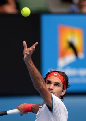 Roger Federer of Switzerland serves during the men s singles 3rd round match at 2014 Australian Open tennis tournament in Melbourne, Australia, Jan. 18, 2014. (Xinhua Li Jundong) (SP)AUSTRALIA-MELBOURNE-TENNIS-AUSTRALIAN OPEN 