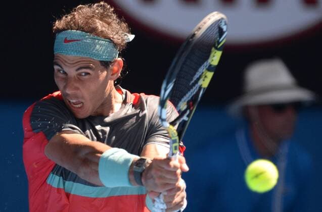 (140122) -- MELBOURNE, Jan. 22, 2014 (Xinhua) -- Rafael Nadal of Spain hits a return during the men s singles quarterfinal at 2014 Australian Open tennis tournament in Melbourne, Australia, Jan. 22, 2014. (Xinhua Li Jundong) (SP) AUSTRALIA-MELBOURNE-TENNIS-NADAL VS DIMITROV 