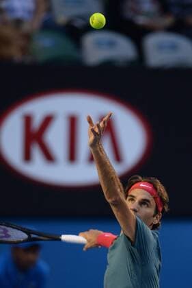 (140122) -- MELBOURNE, Jan. 22, 2014 (Xinhua) -- Roger Federer of Switzerland serves the ball during his men s singles quarterfinal at 2014 Australian Open tennis tournament in Melbourne, Australia, Jan. 22, 2014. 
